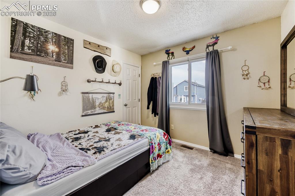 Image 18 of 26: Bedroom