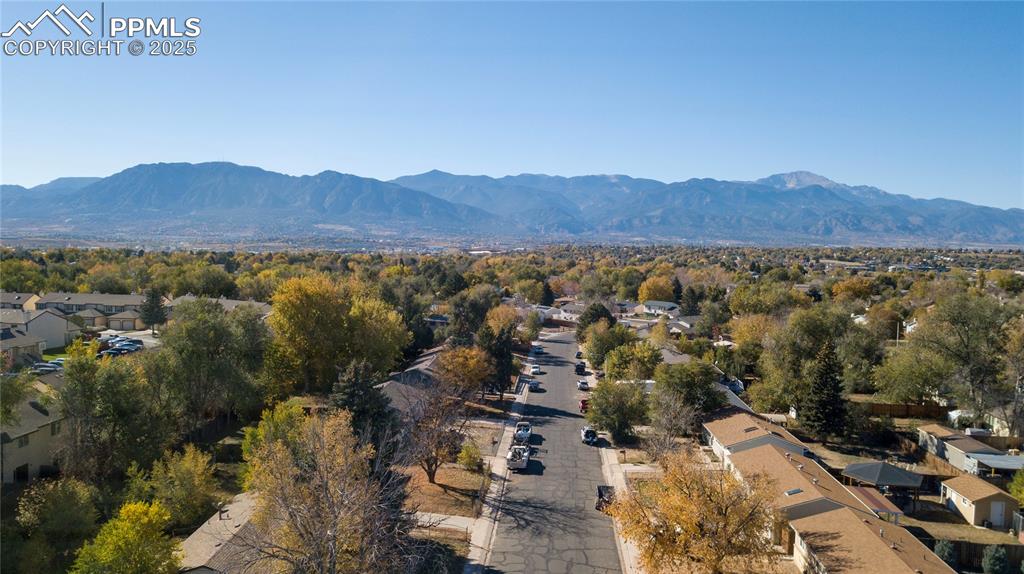 Image 11 of 15: View of mountain background featuring nearby suburban area