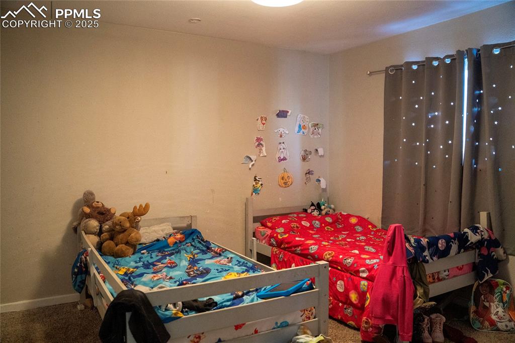 Image 8 of 15: Main level bedroom