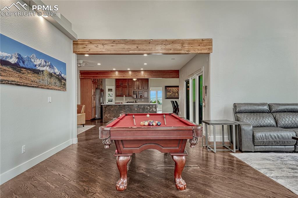 Image 37 of 47: Playroom featuring pool table, wood finished floors, and recessed lighting