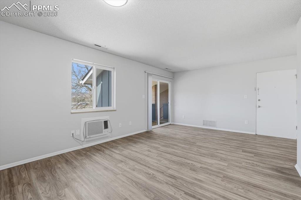 Image 12 of 34: Sliding door to balcony.