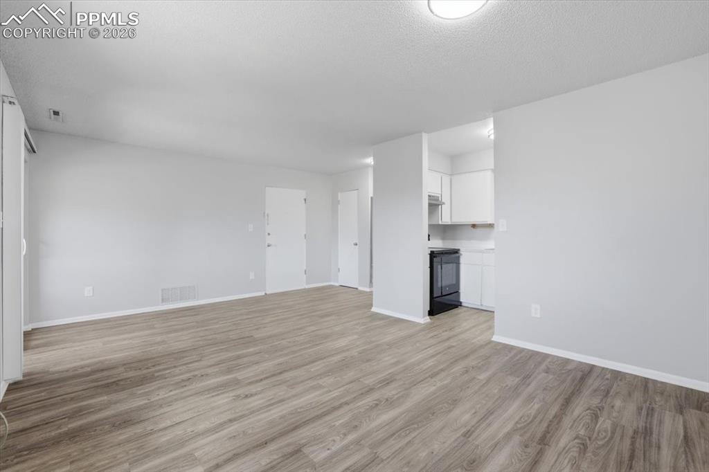 Image 13 of 34: Living room with new flooring.