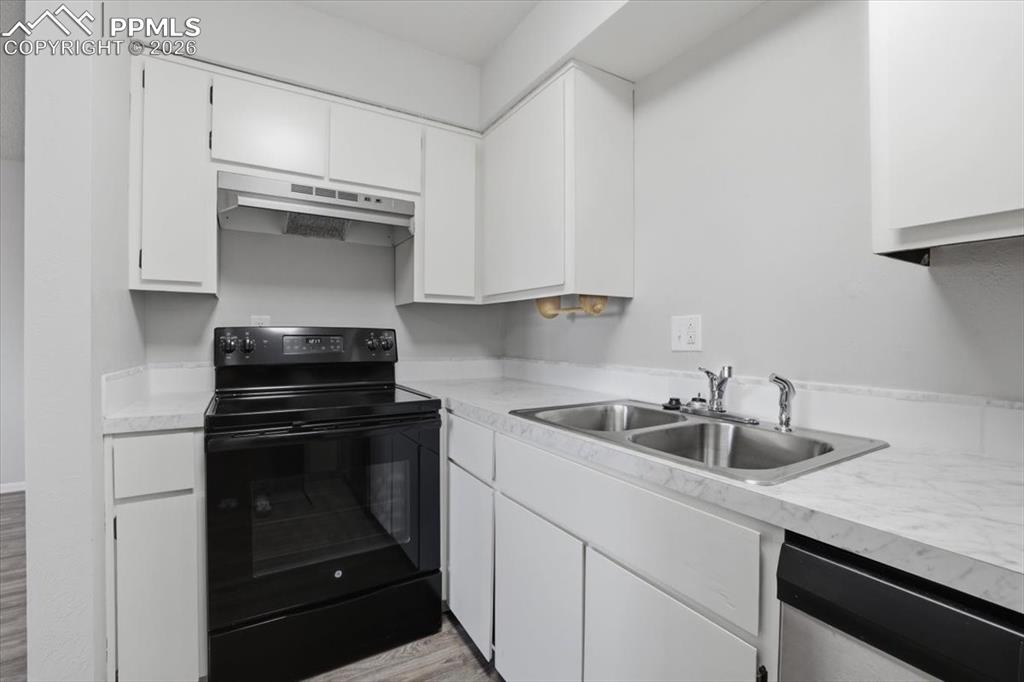 Image 17 of 34: Updated kitchen with new counters and sink.