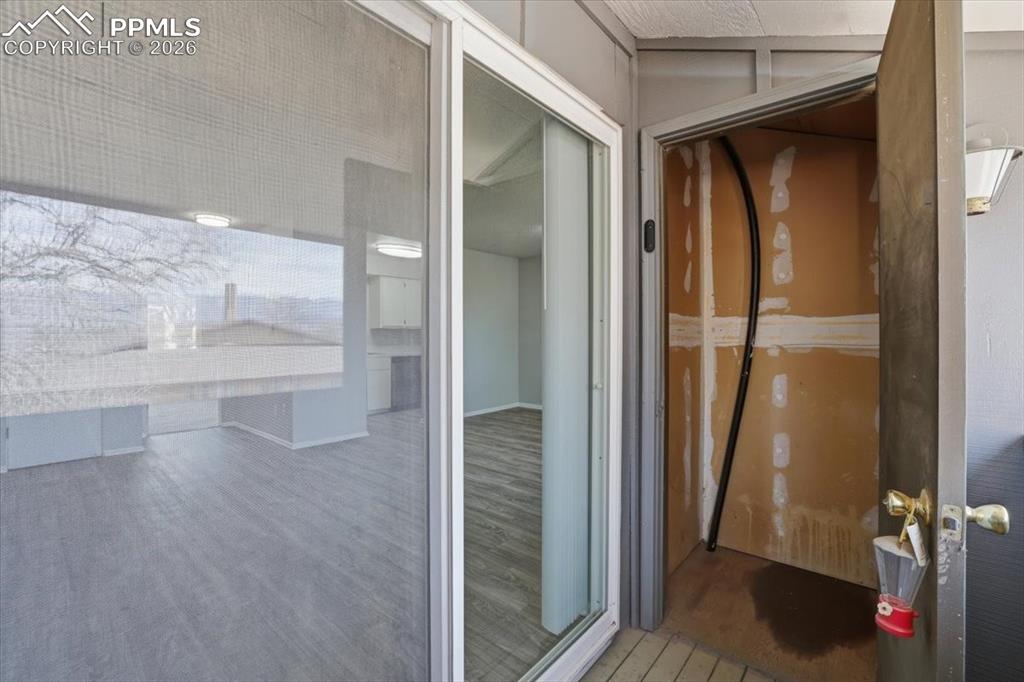 Image 26 of 34: Back deck with storage.