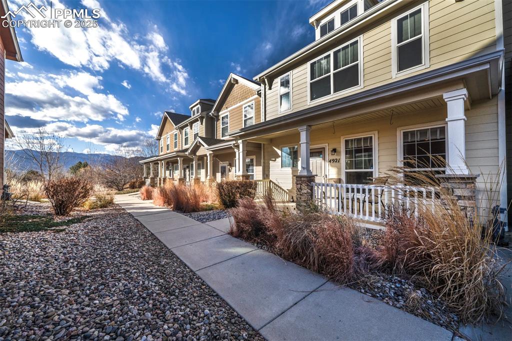 Image 2 of 43: View of property exterior featuring a porch and a mountain view