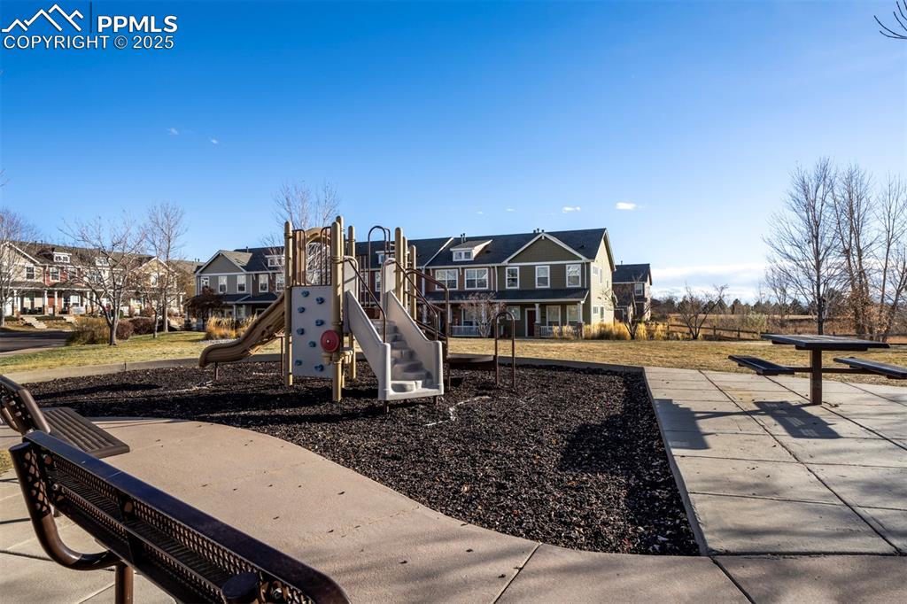 Image 5 of 43: Community jungle gym featuring a residential view