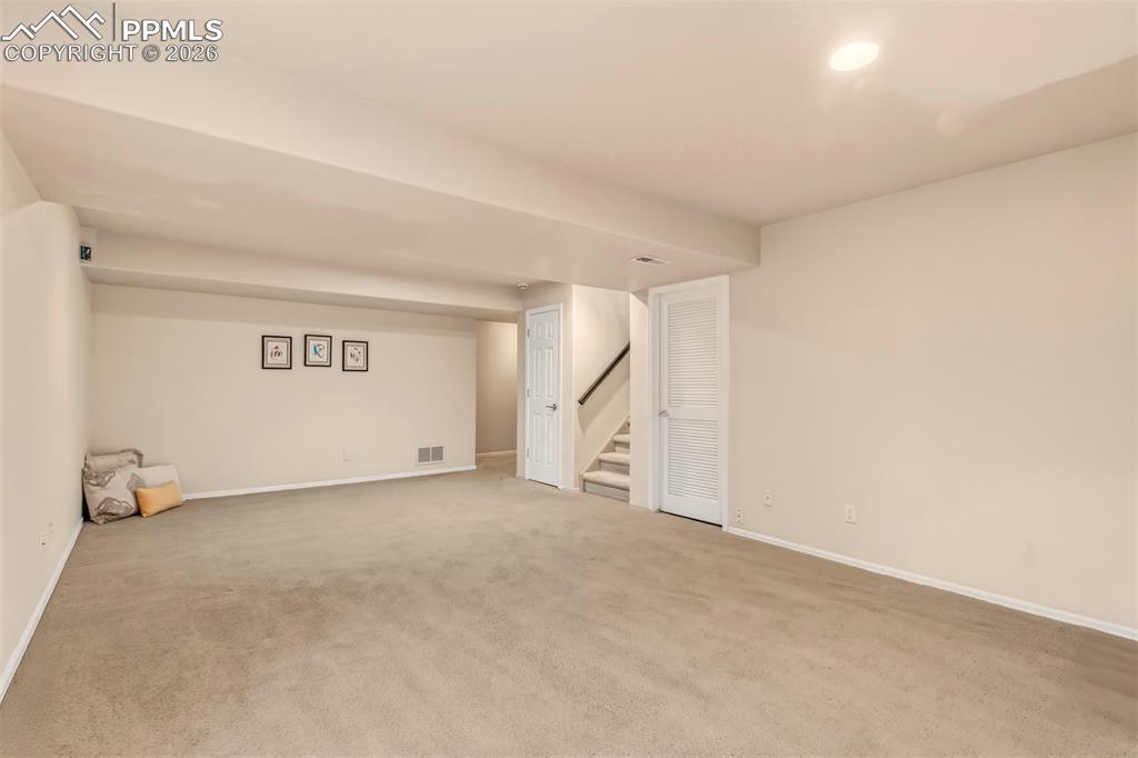 Image 22 of 30: Family room measuring 14x24, offering ample space for entertaining.