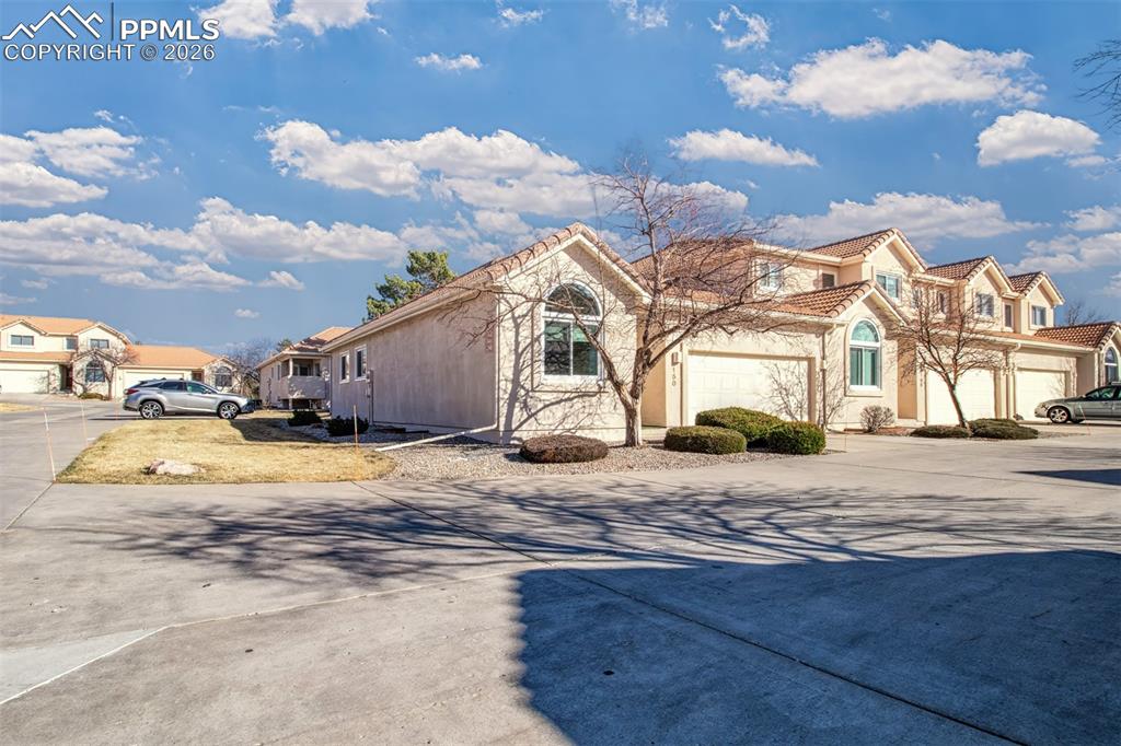 Image 30 of 30: Additional parking located just past the house, providing extra space for g