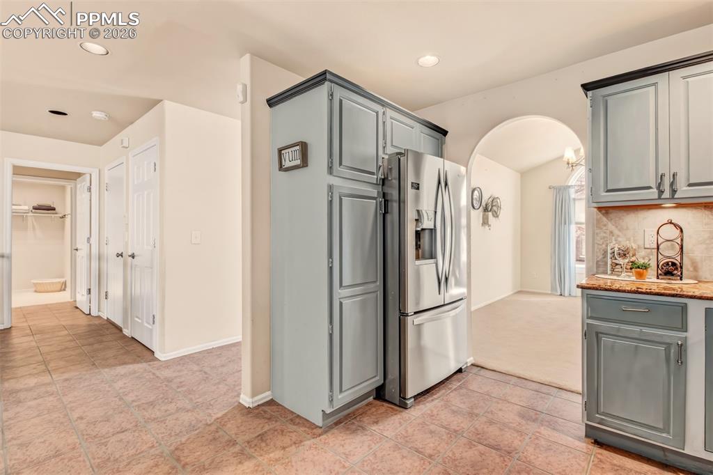 Image 7 of 30: Kitchen with clear view of the formal dining room plus easy access to the n