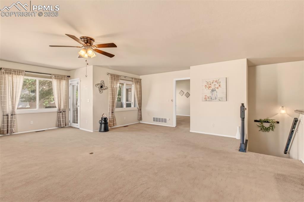 Image 9 of 30: From the living room, enjoy easy access to the covered patio, master bedroo