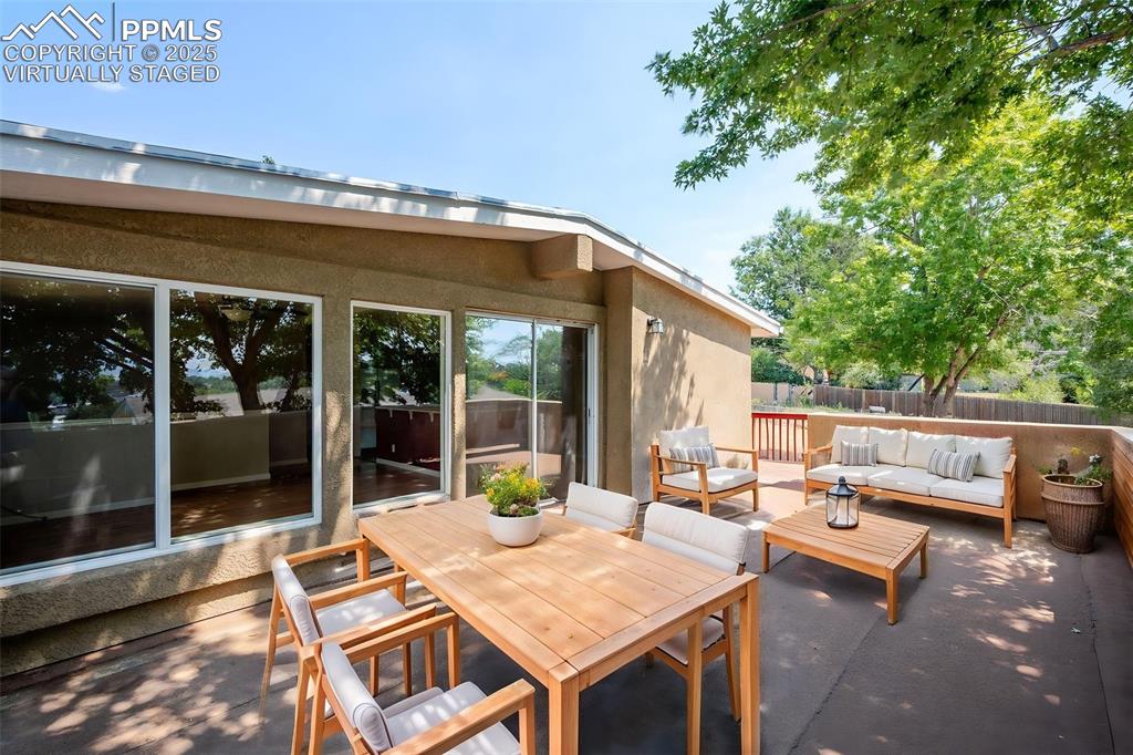 Image 38 of 43: virtually staged upper patio