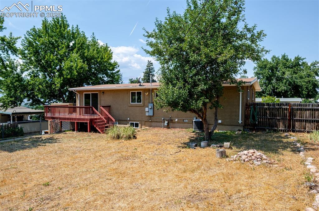 Image 41 of 43: Back of property with a deck
