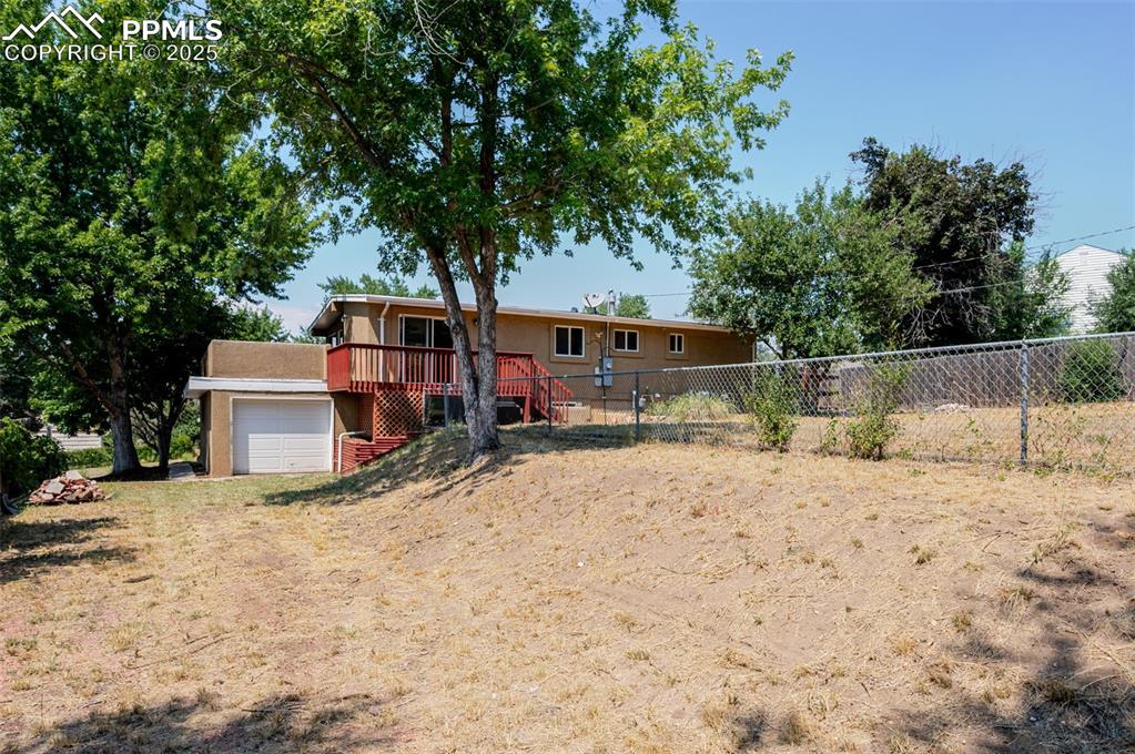Image 43 of 43: Large yard with alley access and drive through garage