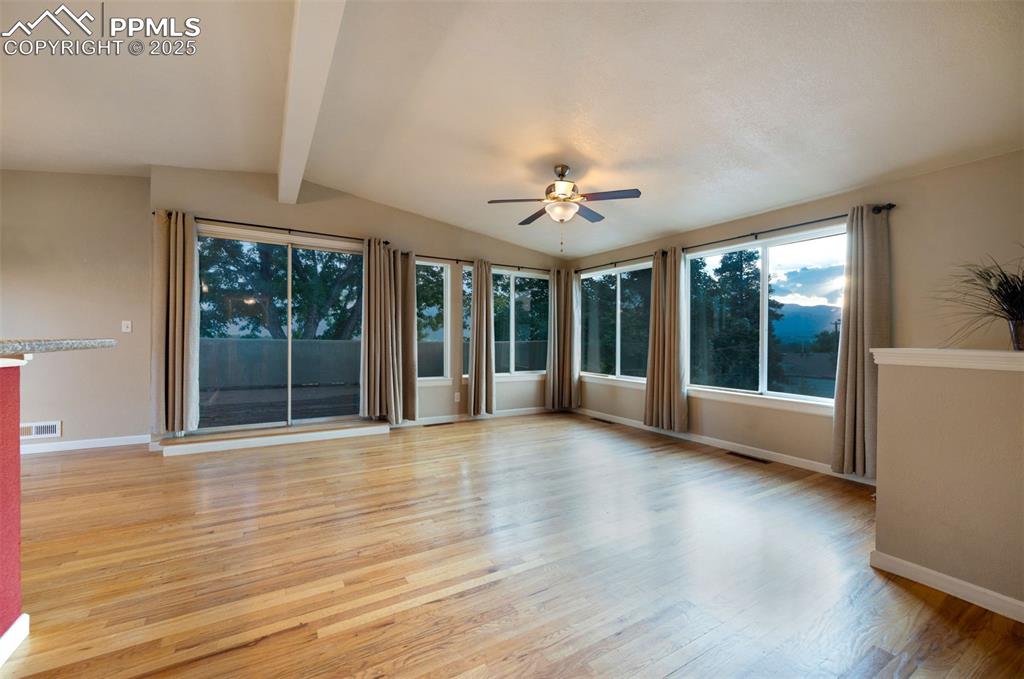 Image 6 of 43: Living room with beautiful hardwood floors
