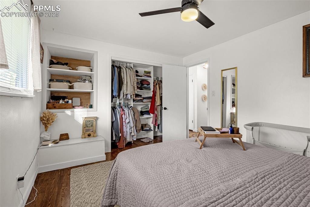 Image 17 of 32: Bedroom featuring a closet, wood finished floors, and ceiling fan