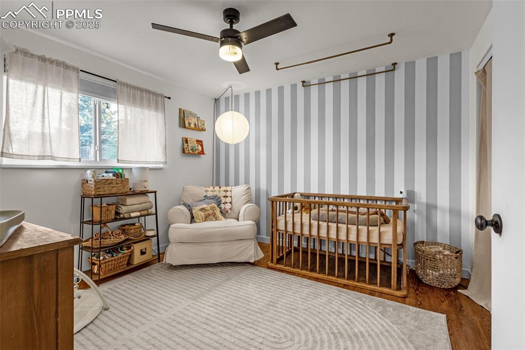 Image 8 of 32: Bedroom with wood finished floors
