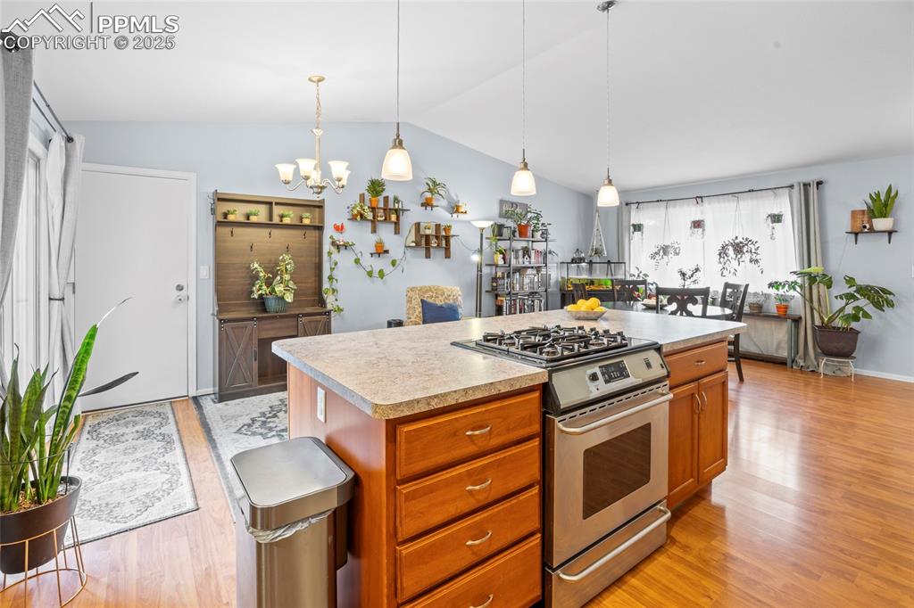 Image 22 of 50: Kitchen with gas stove, and large island