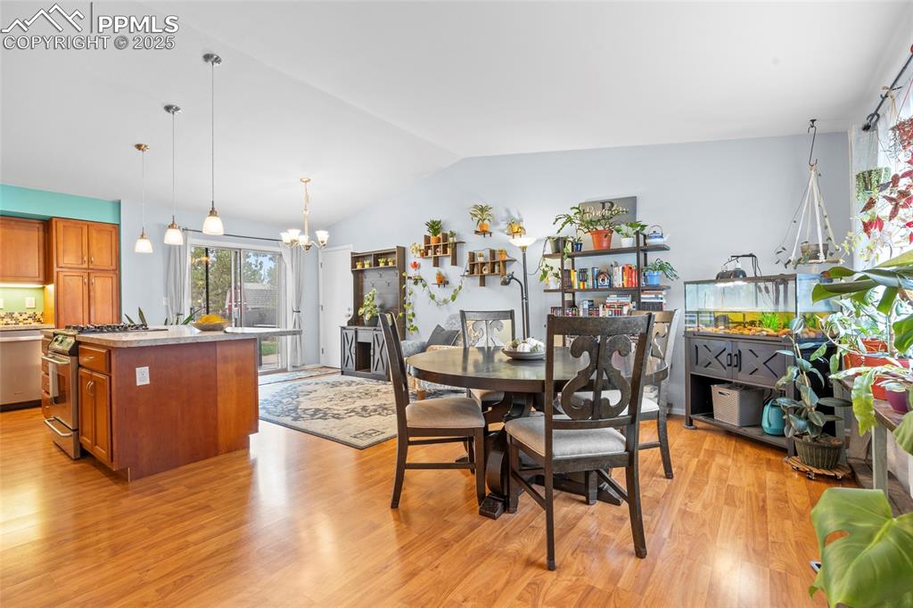 Image 25 of 50: Dining space featuring plenty of natural light, light wood finished floors,