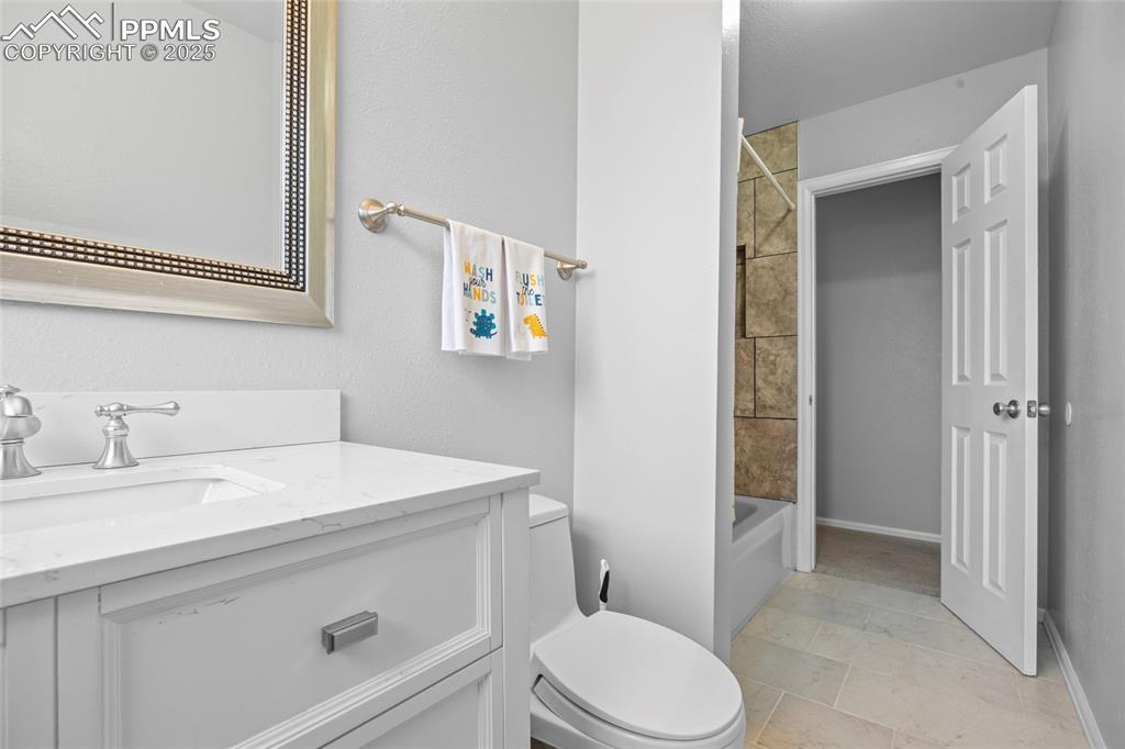 Image 9 of 50: Upper Guest Full Bathroom