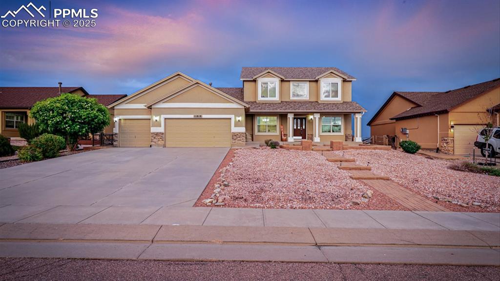 Image 17 of 50: This stunning 2-story home boasts a covered front porch and expanded front 