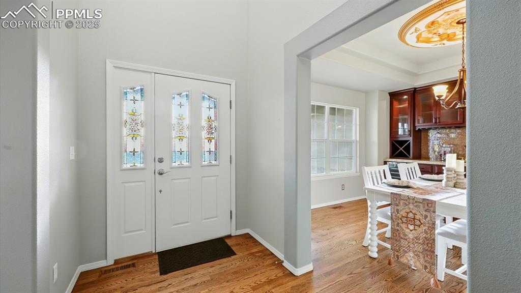 Image 20 of 50: Front Entry into the Formal Dining Room.