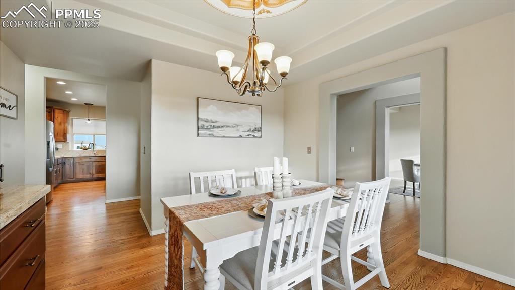 Image 22 of 50: The Formal Dining Room has convenient access to the Gourmet Kitchen making 
