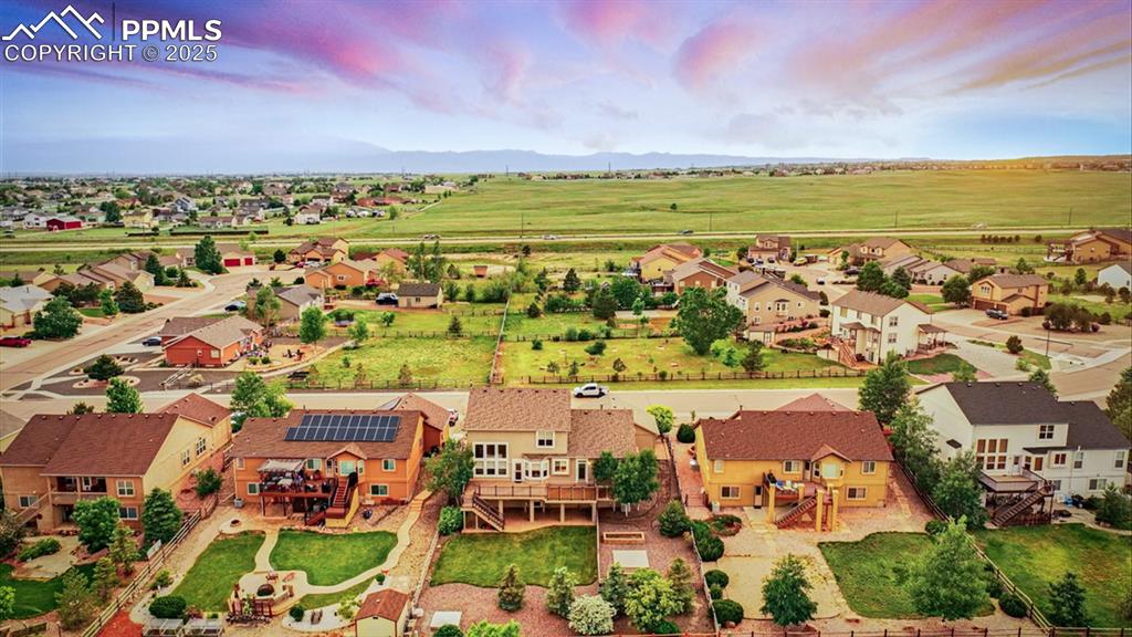 Image 3 of 50: Aerial rear view of home, Pikes Peak view, and Antler Creek Golf Course.
