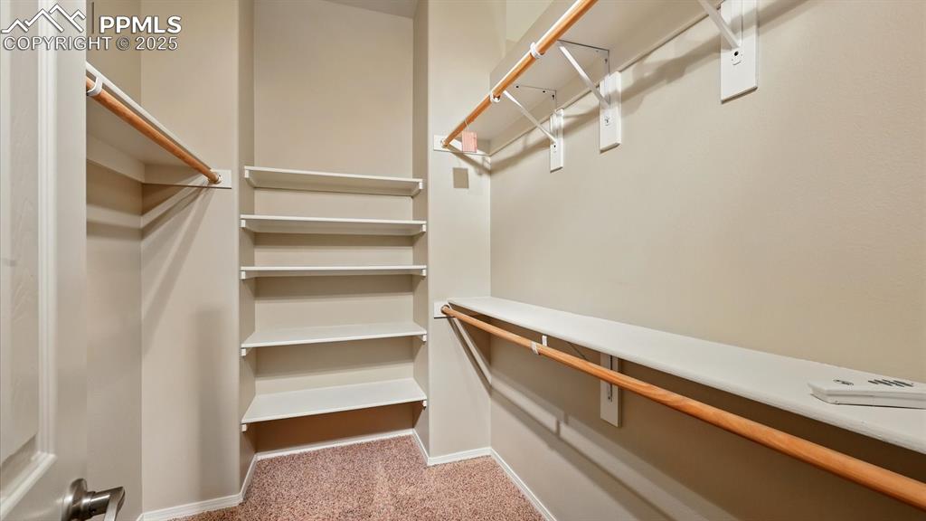 Image 32 of 50: Walk in closet in Primary Bedroom.