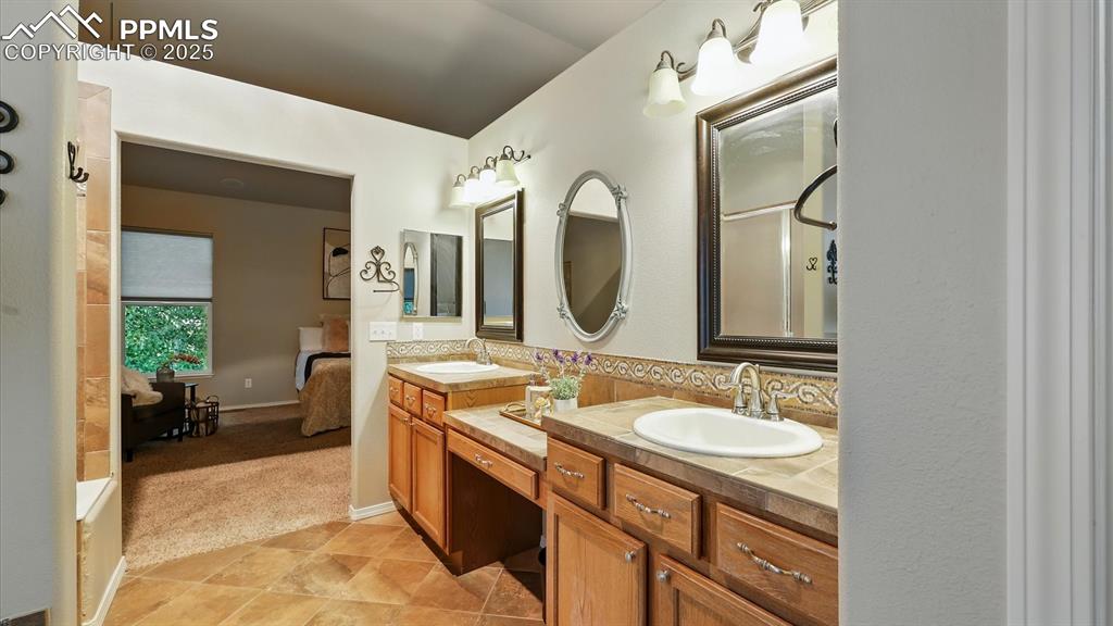 Image 33 of 50: Dual sink vanity with make up counter in Primary Bedroom.