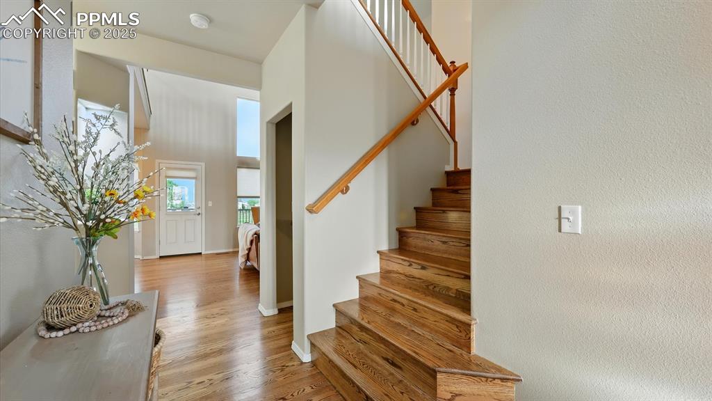 Image 34 of 50: Front Entry with stairs to the upper level.