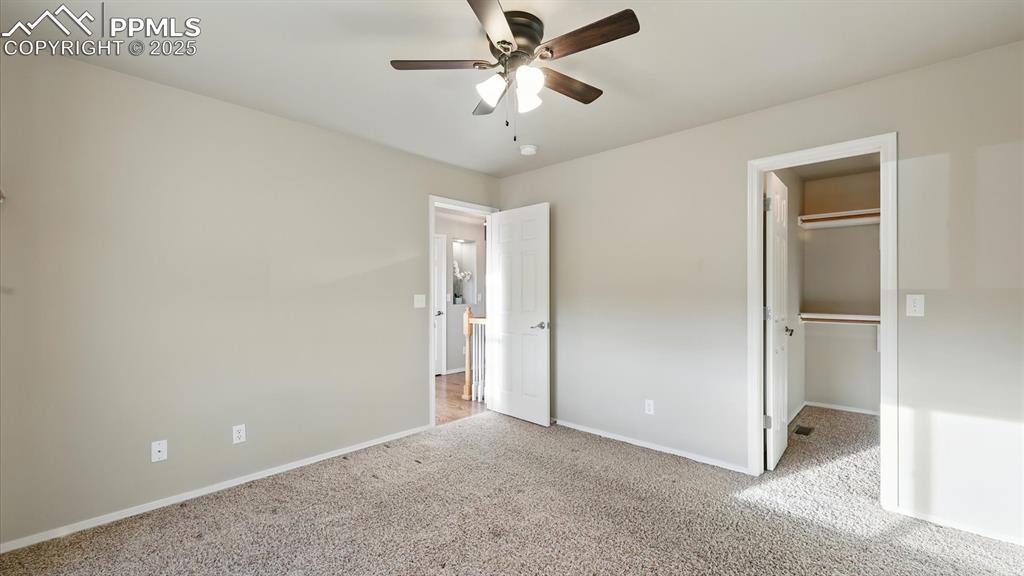 Image 40 of 50: Upper Level Bedroom #3 also has a walk in closet.