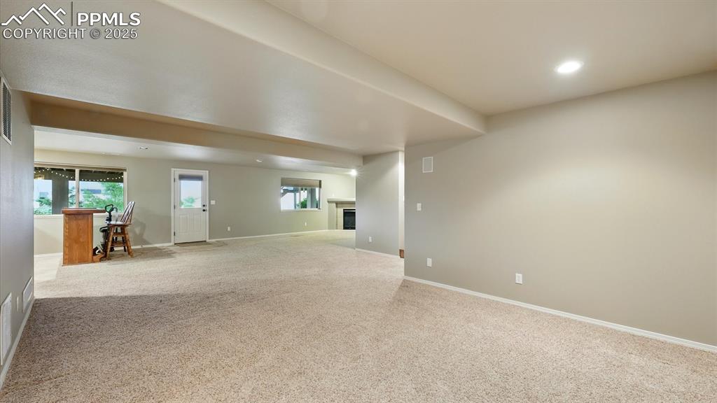 Image 42 of 50: Huge walk out finished Basement with Theatre Area, Family Room, and wet bar