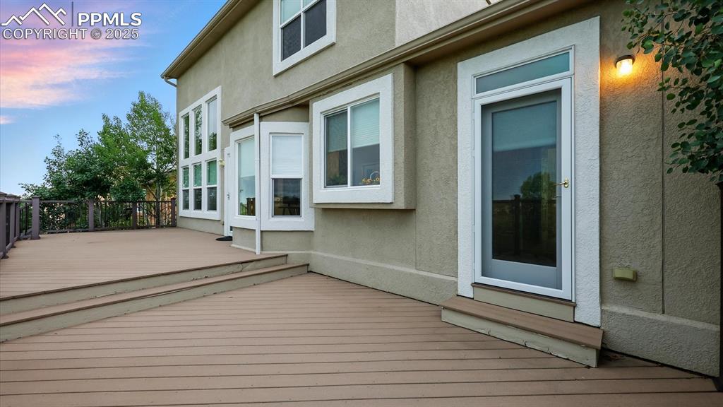 Image 6 of 50: Walk out from the Dining Nook to a composite deck to enjoy golf course and 