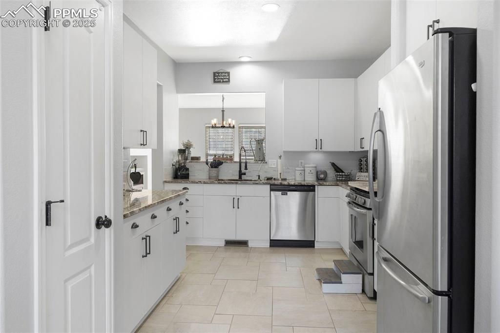 Image 10 of 47: Garage access in the kitchen,  eat in kitchen, set up as a coffee station