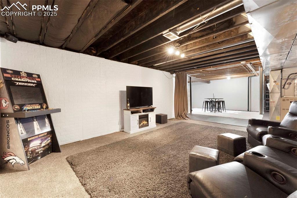 Image 22 of 47: Unfinished Basement Movie room