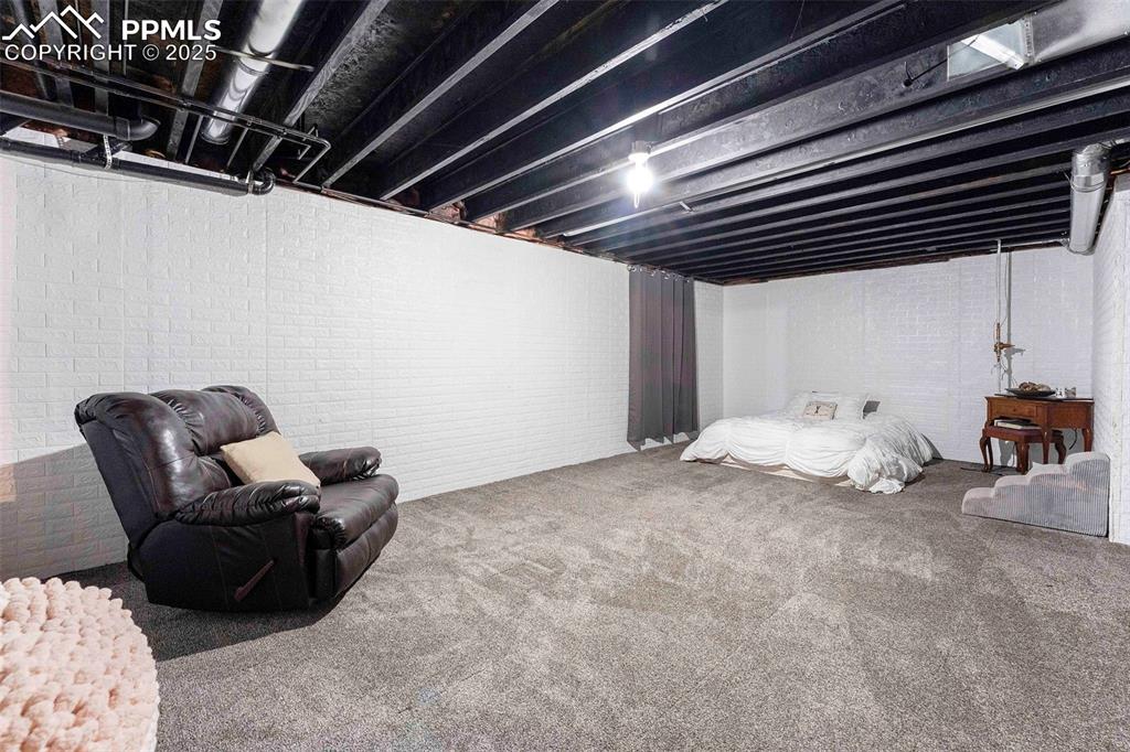 Image 26 of 47: Unfinished basement Bedroom space