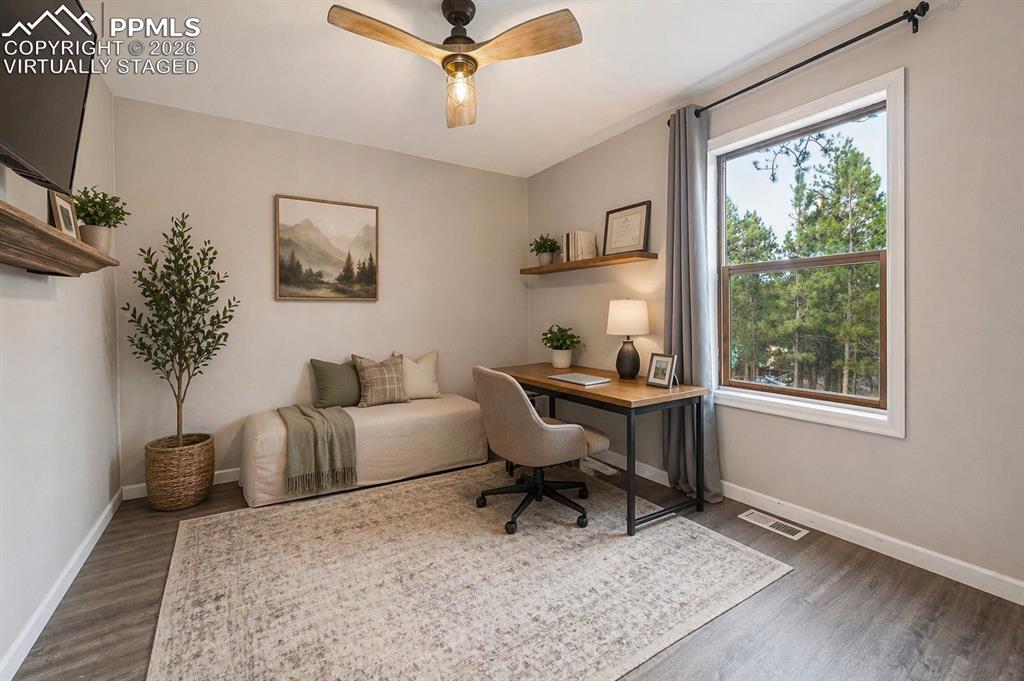 Image 20 of 25: Main level bedroom- virtually staged 