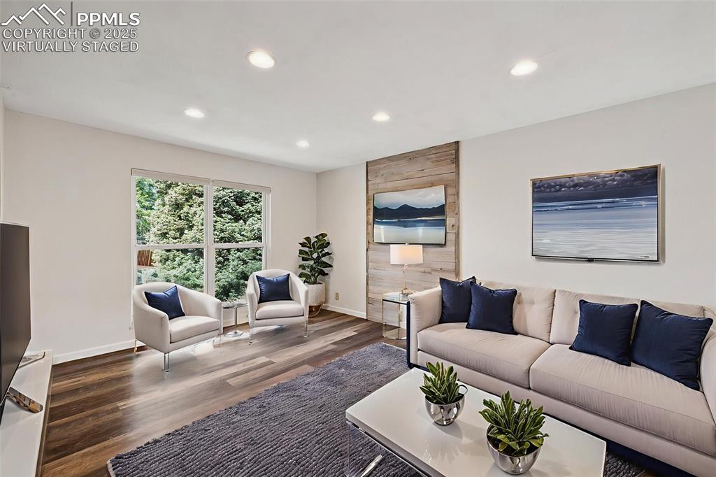 Image 10 of 35: Living room featuring recessed lighting and wood finished floors. Virtually