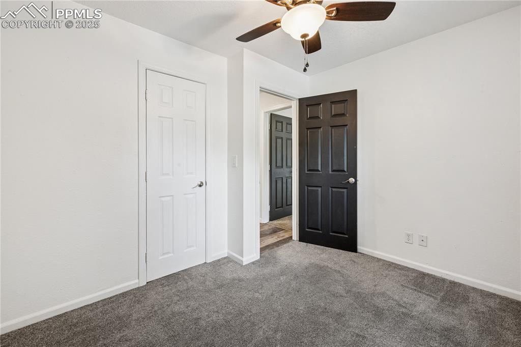 Image 27 of 35: bedroom featuring carpet flooring and ceiling fan