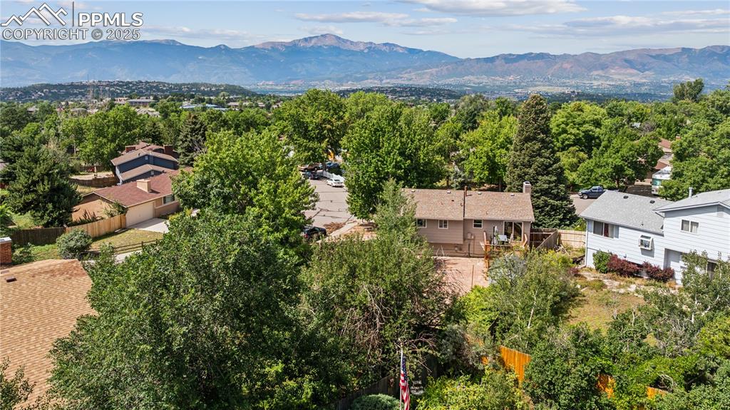 Image 5 of 35: Aerial perspective of suburban area with mountains