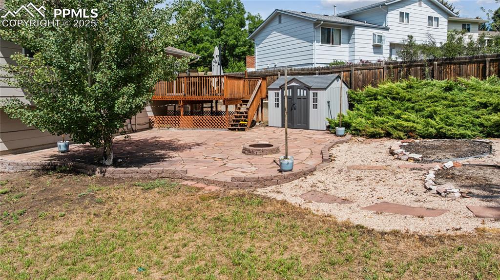 Image 8 of 35: Beautiful back yard entertaining area with bonus shed and outdoor furniture