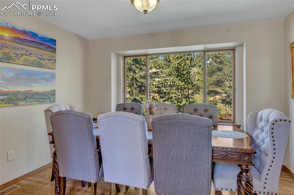 Image 10 of 39: Dining Room, Large Window, Nature View, Tree Views,