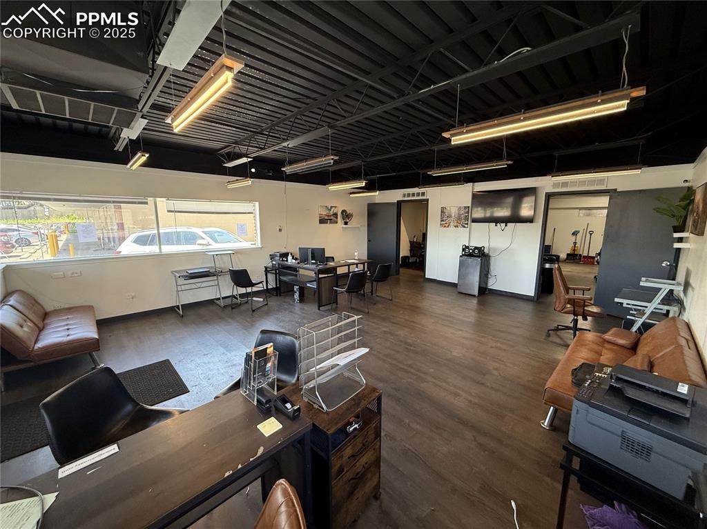 Image 25 of 28: Office space with wood finished floors