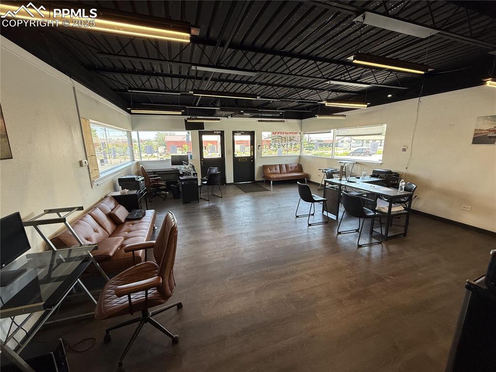 Image 6 of 28: Dining room featuring an office area and wood finished floors