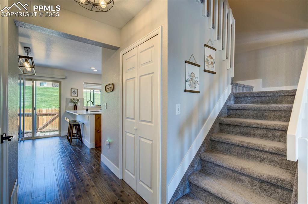 Image 5 of 30: Staircase featuring wood finished floors and baseboards