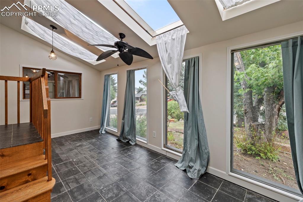 Image 4 of 49: Sunroom off front of the home.
