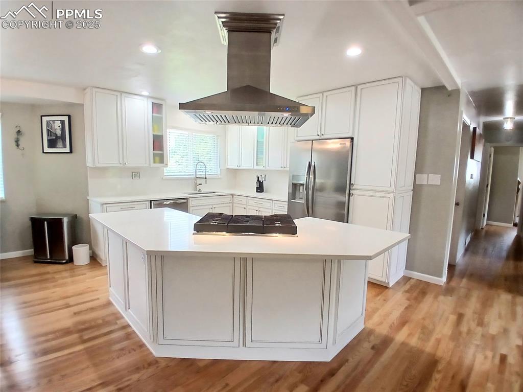 Image 10 of 49: Kitchen featuring all new stainless steel appliances and white tinted cabin