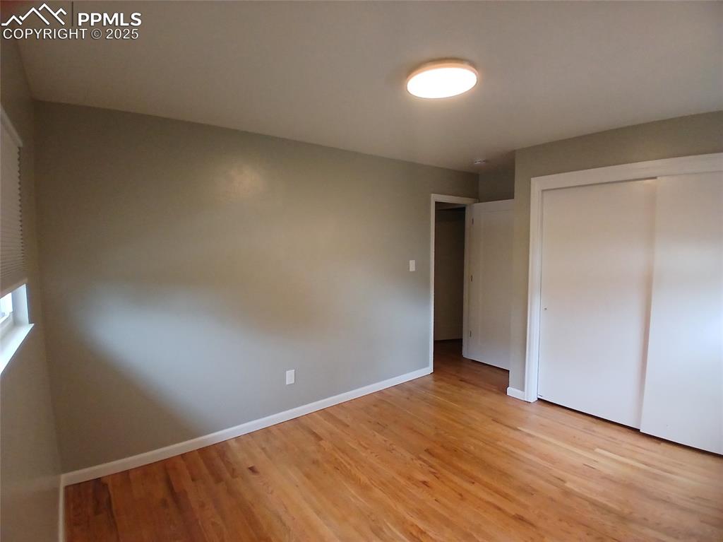 Image 27 of 49: Unfurnished bedroom featuring a closet and light wood-type flooring