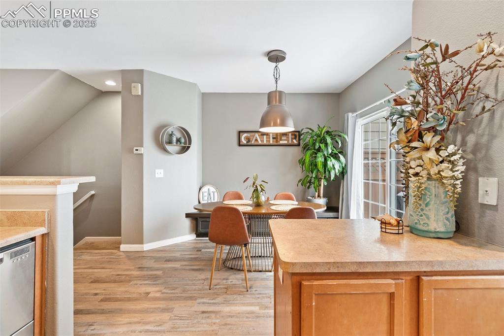 Image 12 of 36: Dining space with light wood-type flooring, recessed lighting, and baseboar