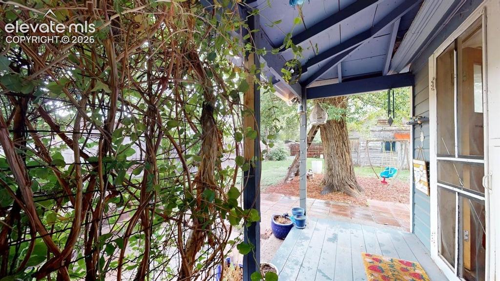Image 35 of 49: View of yard back porch